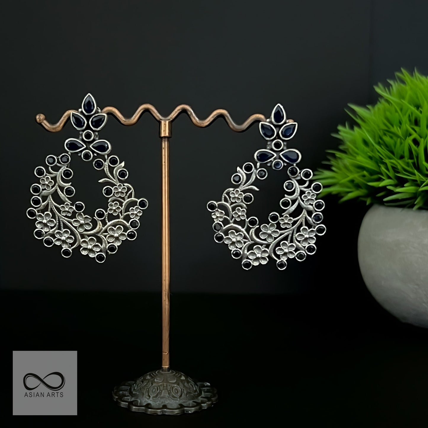 Silver casting floral cut stone earrings