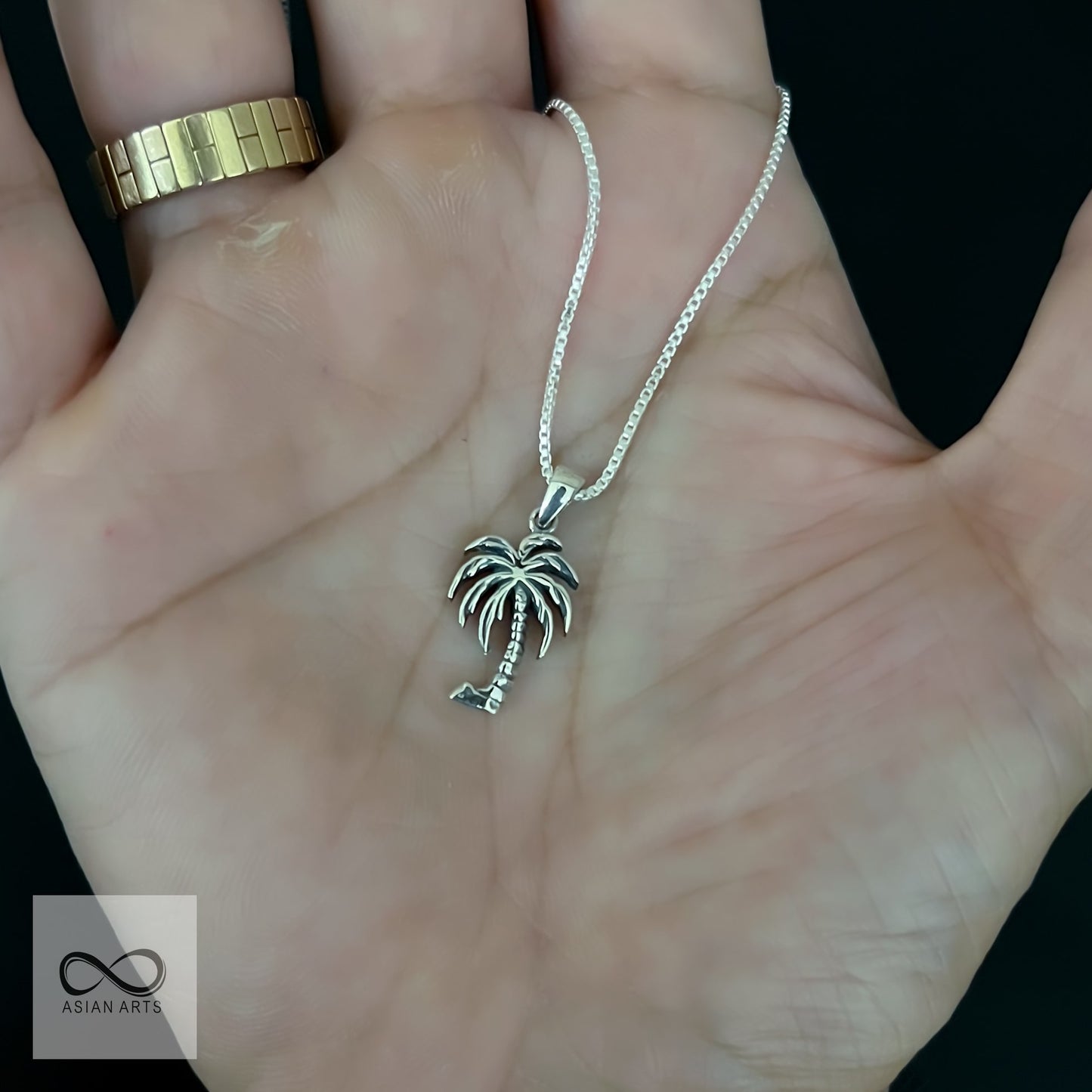 Silver palm tree pendant