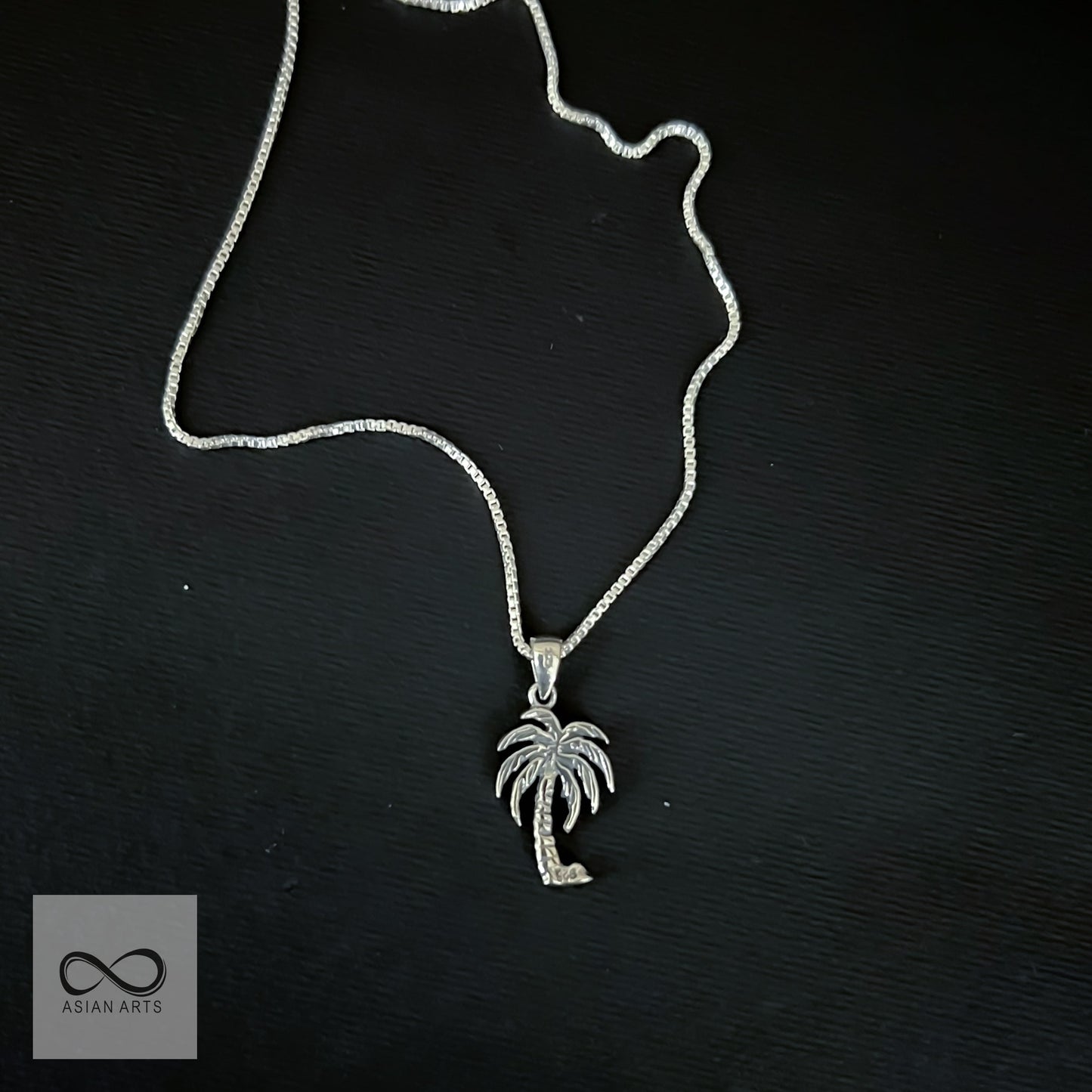 Silver palm tree pendant