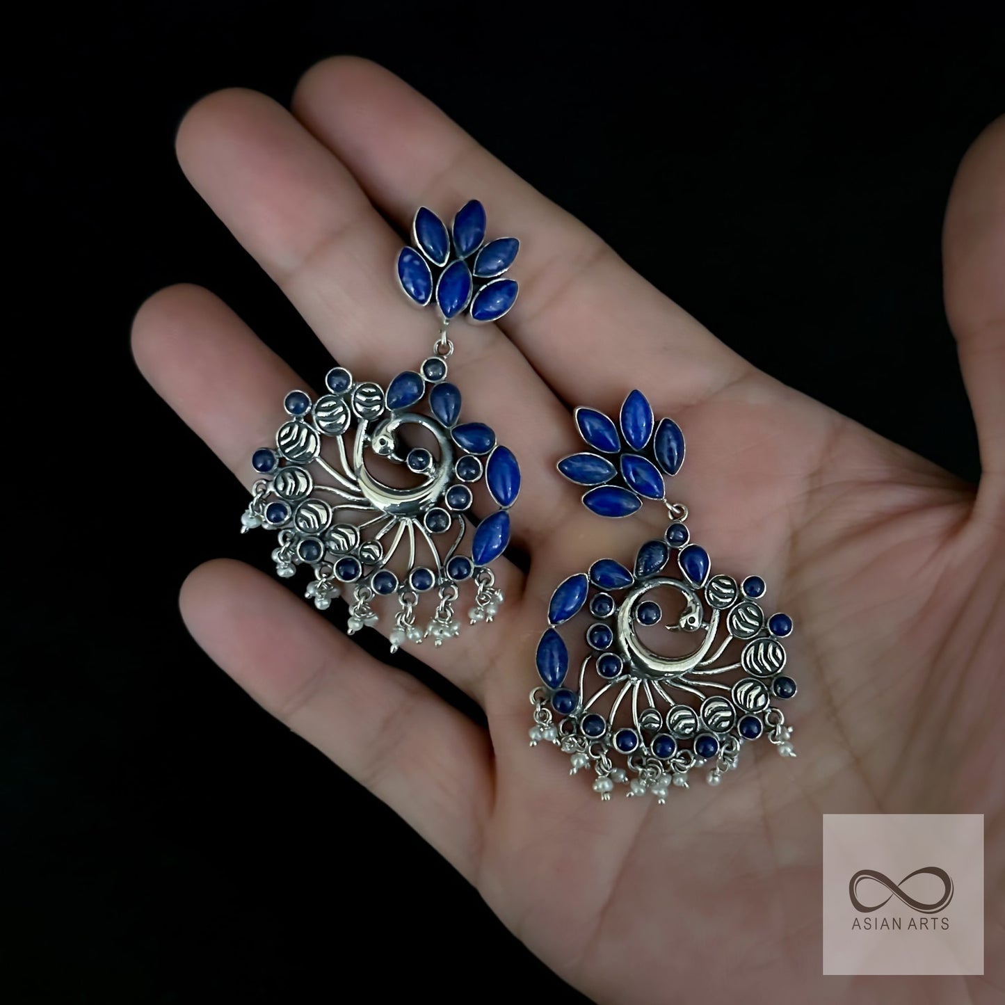 Quirky peacock earrings with stone